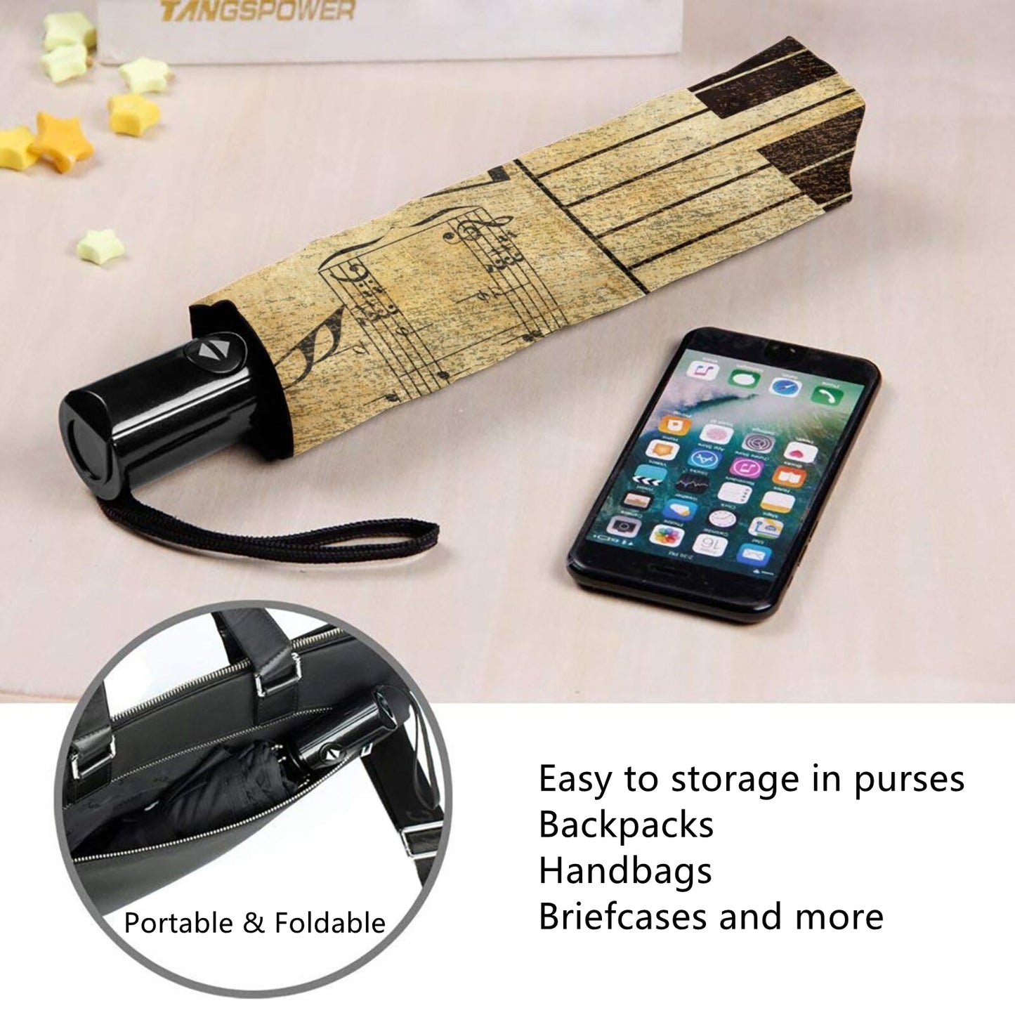 Kleiner kompakter Regenschirm mit Klaviertasten im Inneren