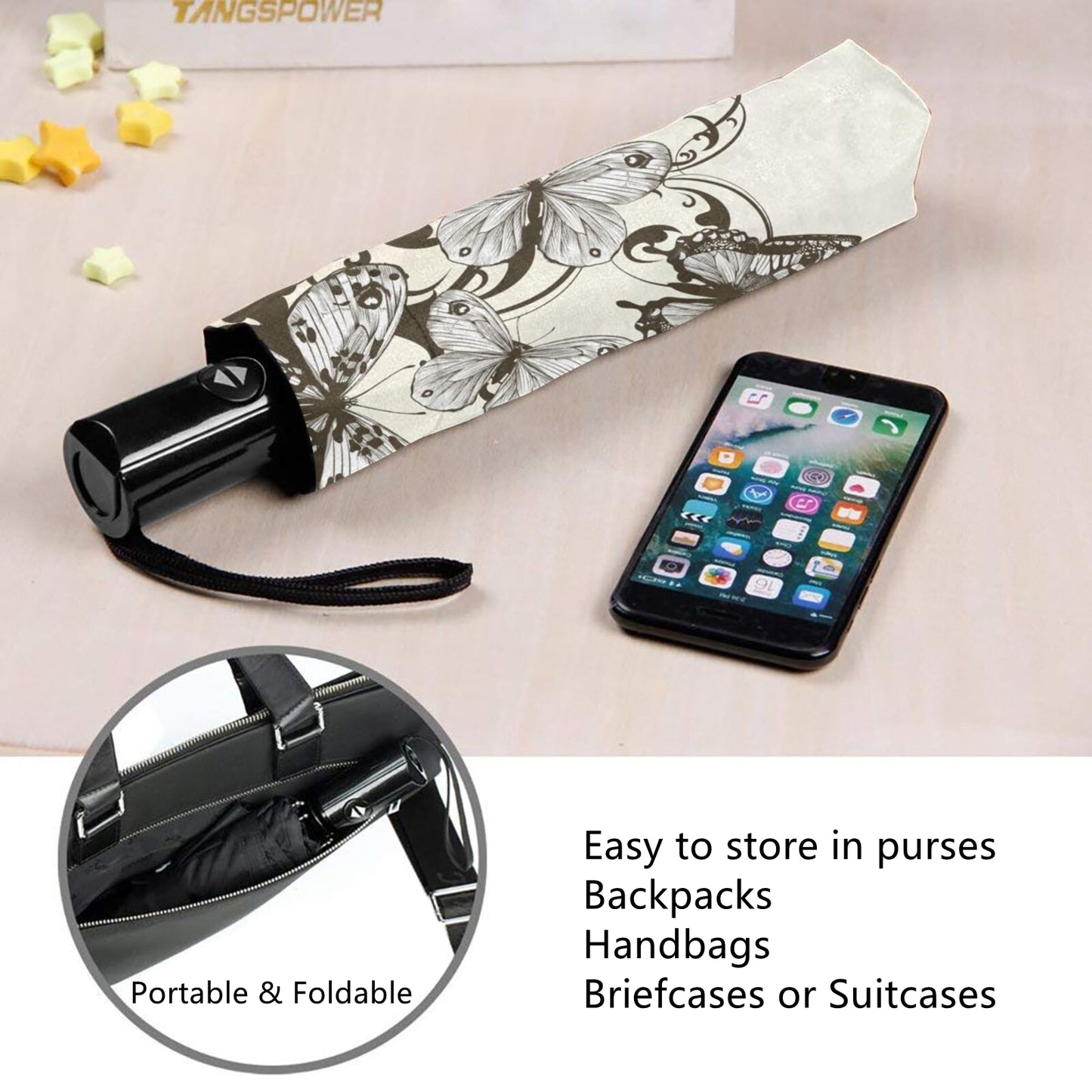 Kompakter Regenschirm mit klassischem Schmetterlingsdesign im Inneren