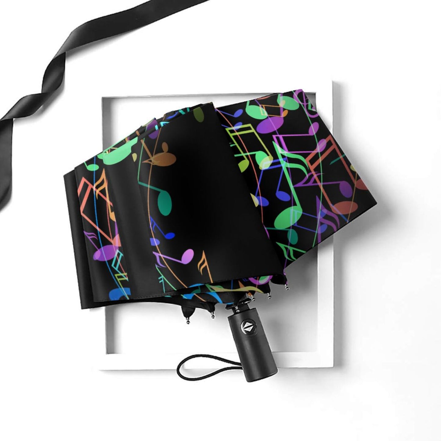 Parapluie compact automatique à motif de notes de musique colorées