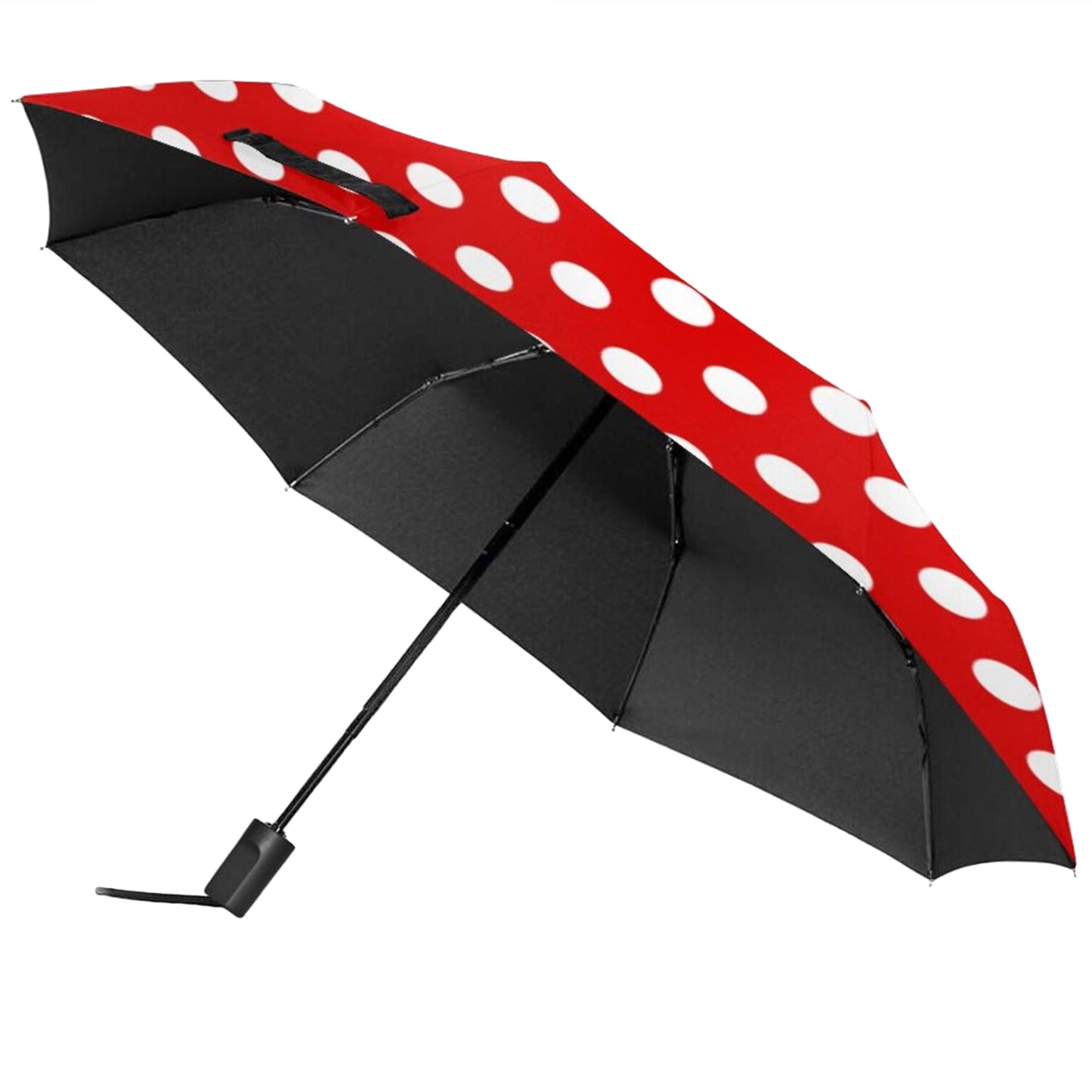 Manueller Taschenschirm mit roten und weißen Punkten