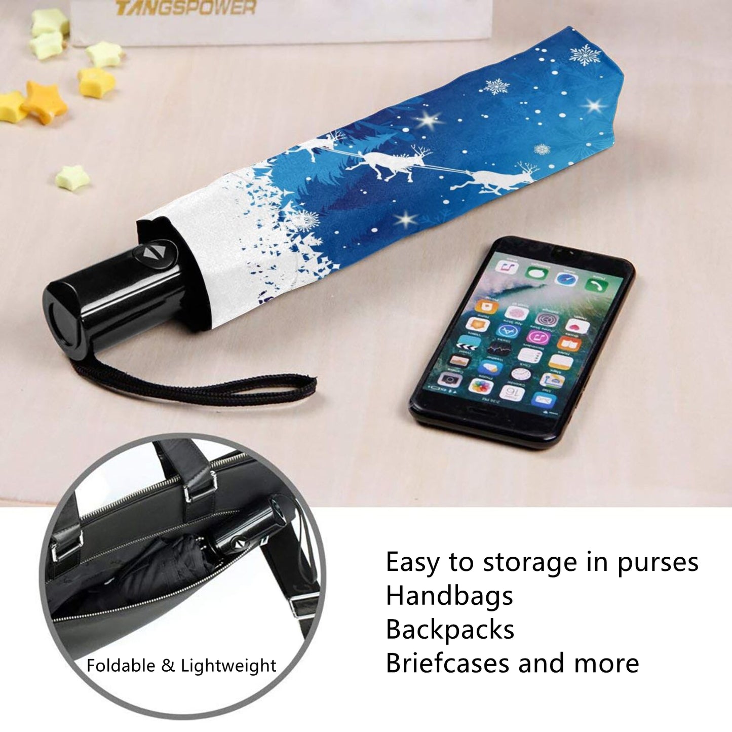 Kompakter Regenschirm mit weihnachtlichen Elementen im Inneren