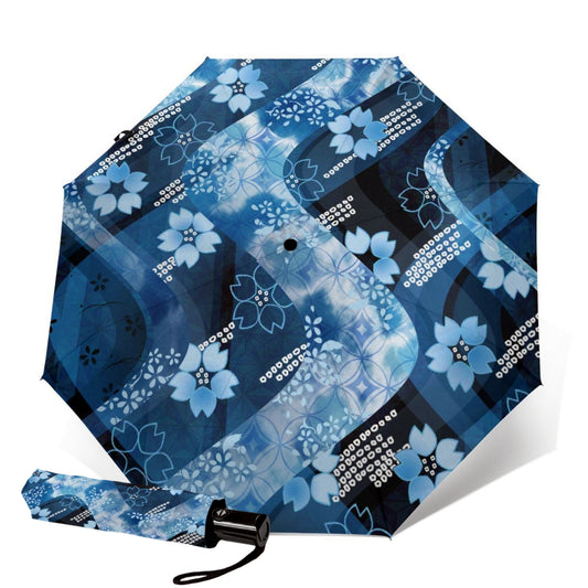 Blauer faltbarer Regenschirm mit Blumenmuster